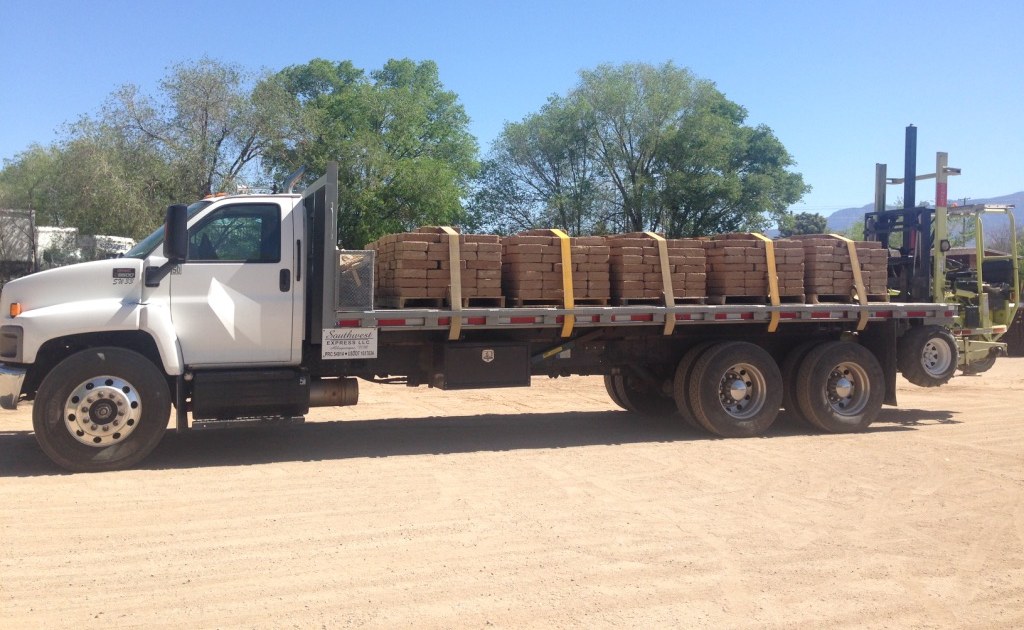 Delivery truck loaded with adobe block pallets